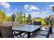 Outdoor dining setup on a deck, offering a perfect space for entertaining and relaxation at 8023 Gore Creek Ln, Littleton, CO 80125