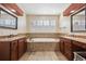 Double vanity bathroom with soaking tub and lots of natural light at 8631 Gladiola Cir, Arvada, CO 80005