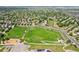 Panoramic aerial view of a park, showcasing playgrounds, sports courts, and green spaces in a community at 13660 Monroe St, Thornton, CO 80602