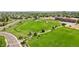 Overhead shot of the park showcasing trails, green fields, a stream, and surrounding neighborhood at 13660 Monroe St, Thornton, CO 80602
