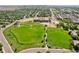 Scenic aerial view of the neighborhood park featuring open green spaces, playgrounds, and walking paths at 13660 Monroe St, Thornton, CO 80602