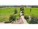 Picturesque neighborhood park showcasing manicured green spaces, a walking path, and mature trees at 13660 Monroe St, Thornton, CO 80602