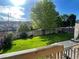 Large backyard featuring a well-maintained lawn, mature tree, wooden fence, and a deck at 13660 Monroe St, Thornton, CO 80602