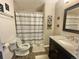 Cozy bathroom featuring a shower over the tub, modern vanity and neutral design at 13660 Monroe St, Thornton, CO 80602