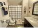 Cozy bathroom featuring a shower over the tub, modern vanity and neutral design at 13660 Monroe St, Thornton, CO 80602