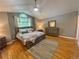 This bedroom boasts a beautiful vaulted ceiling, a neutral color palette and a large arched window at 13660 Monroe St, Thornton, CO 80602