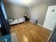Bright bedroom with hardwood floors, playful decor, and a large window with natural light at 13660 Monroe St, Thornton, CO 80602