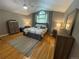 This bedroom boasts a beautiful vaulted ceiling, a neutral color palette and warm wood flooring at 13660 Monroe St, Thornton, CO 80602