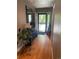Inviting entryway with hardwood floors, complemented by plants and natural light at 13660 Monroe St, Thornton, CO 80602