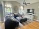 Spacious living room with vaulted ceilings, a ceiling fan, and a large sectional sofa at 13660 Monroe St, Thornton, CO 80602