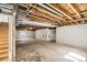 Unfinished basement featuring exposed utilities and a concrete floor at 261 Hermosa St, Brighton, CO 80603