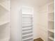 Walk-in closet with wooden floors, shelving, and hanging rods at 261 Hermosa St, Brighton, CO 80603