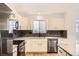 Stylish kitchen with stainless steel appliances, sleek countertops, and crisp white cabinets at 261 Hermosa St, Brighton, CO 80603