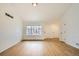 Inviting living room filled with natural light, featuring wood floors and fresh, neutral paint at 261 Hermosa St, Brighton, CO 80603