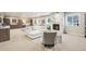 Large finished basement with a comfortable seating area and a unique marble fireplace at 1104 Brocade Dr, Littleton, CO 80126