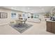 Finished basement with work space, sofa, and marble fireplace at 1104 Brocade Dr, Littleton, CO 80126