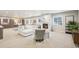 Spacious finished basement with a white sectional sofa and a modern marble fireplace at 1104 Brocade Dr, Littleton, CO 80126