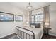 Inviting bedroom with a comfortable metal frame bed, ambient lighting, and decorative artwork at 1104 Brocade Dr, Littleton, CO 80126