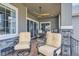 Inviting covered deck featuring comfortable seating and a beautiful view of the neighborhood at 1104 Brocade Dr, Littleton, CO 80126