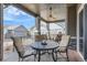 Cozy covered deck with comfortable seating and an outdoor dining area at 1104 Brocade Dr, Littleton, CO 80126