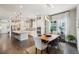 Modern kitchen with stainless steel appliances, white cabinetry, and an island with bar stools at 1104 Brocade Dr, Littleton, CO 80126