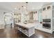 Modern kitchen with a large island, pendant lighting, stainless steel appliances, and ample cabinet space at 1104 Brocade Dr, Littleton, CO 80126