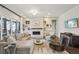 Elegant living room featuring a fireplace, plush seating, and bright, natural light at 1104 Brocade Dr, Littleton, CO 80126