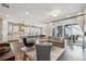 Spacious open-concept living area with hardwood floors and seamless access to the outdoor patio at 1104 Brocade Dr, Littleton, CO 80126