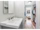 Bathroom with a vintage sink and a view to the bedroom and walk-in closet at 1401 N Franklin St # 2, Denver, CO 80218