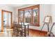 Sunny breakfast nook with a bistro table, hardwood floors, and a large window with natural light at 1401 N Franklin St # 2, Denver, CO 80218