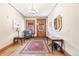 Foyer features hardwood floors, chandelier, and vintage details at 1401 N Franklin St # 2, Denver, CO 80218