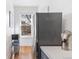 Kitchen area with stainless steel refrigerator, galley layout, and natural light from bay window at 1401 N Franklin St # 2, Denver, CO 80218