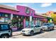 Exterior of a pink donut shop with large windows and parked cars in front at 1401 N Franklin St # 2, Denver, CO 80218