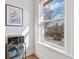 Sunlit room corner with a microwave and shelving under a window with street view at 1401 N Franklin St # 2, Denver, CO 80218