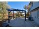 Backyard patio with pergola and concrete flooring at 16521 E Easter Way, Foxfield, CO 80016