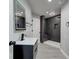 Modern basement bathroom with dark tile shower at 16521 E Easter Way, Foxfield, CO 80016