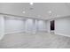 Spacious finished basement with gray flooring at 16521 E Easter Way, Foxfield, CO 80016