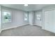 Bright bedroom with new carpet, featuring a door to outside at 16521 E Easter Way, Foxfield, CO 80016