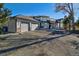 House exterior with three-car garage and driveway at 16521 E Easter Way, Foxfield, CO 80016