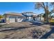 Two-story house with three-car garage and paved driveway at 16521 E Easter Way, Foxfield, CO 80016