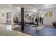 Basement gym with exercise equipment and mirrored wall, offering a private workout space at 6834 Hillside Way, Parker, CO 80134