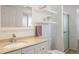 Bright bathroom with floating shelves, vanity, and updated fixtures at 6834 Hillside Way, Parker, CO 80134