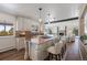 Open concept kitchen with a large island, butcher block countertop, and stainless steel appliances at 6834 Hillside Way, Parker, CO 80134