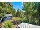 View from back deck to backyard with building at 10411 Dowdle Dr, Golden, CO 80403