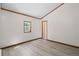 Spacious bedroom featuring light grey laminate flooring and light walls at 10411 Dowdle Dr, Golden, CO 80403