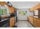 Kitchen features stainless steel appliances, wood cabinets, and hardwood floors at 10411 Dowdle Dr, Golden, CO 80403