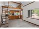 Kitchen features stainless steel appliances, custom wood cabinets, and hardwood floors at 10411 Dowdle Dr, Golden, CO 80403