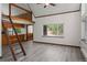 Living room features a loft, hardwood floors, a window, and a ladder to the loft at 10411 Dowdle Dr, Golden, CO 80403