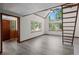 Bright living room with vaulted ceilings, large windows, and stylish laminate flooring at 10411 Dowdle Dr, Golden, CO 80403