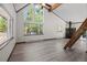 Spacious living room with vaulted ceilings, wood-burning stove, and large windows at 10411 Dowdle Dr, Golden, CO 80403